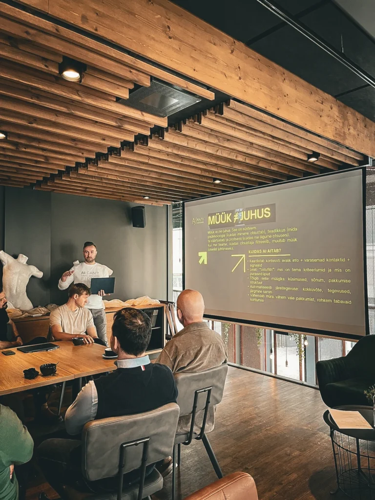 AI sales training: the presenter explains sales preparation using a projected slide.